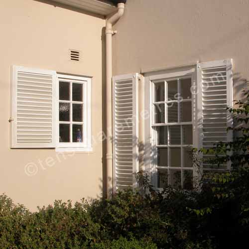 french shutters on 1920s house